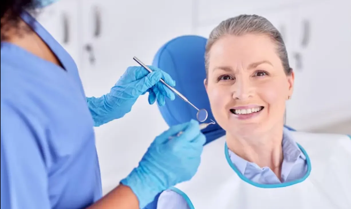Denture dentist providing professional smile restoration