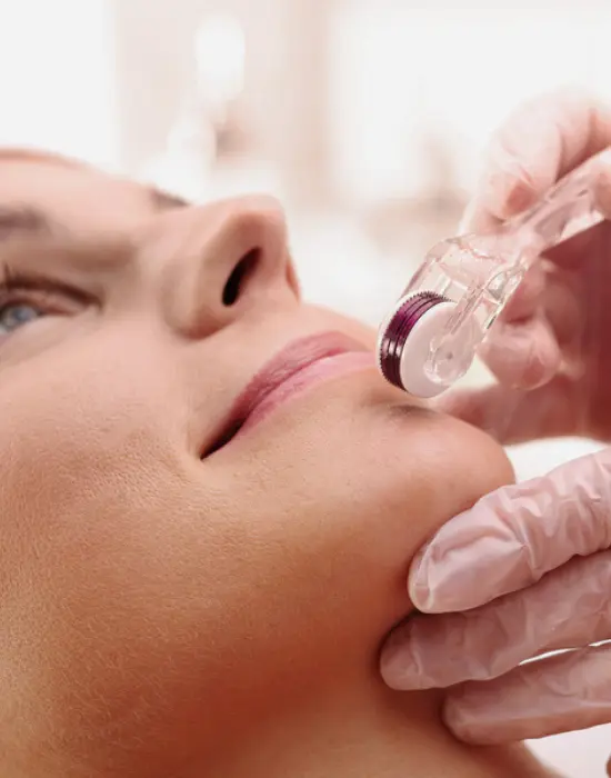 A patient receiving a skin treatment at ATOS Medical Center