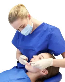 Dentist treating a patient at ATOS Medical Center