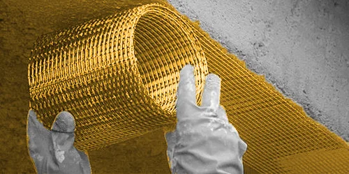 Reinforcing fabric being bonded around a concrete member
