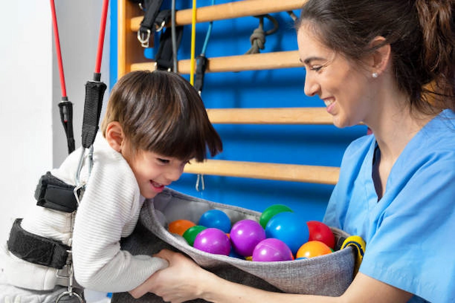 Child practicing balance in motor skills therapy.