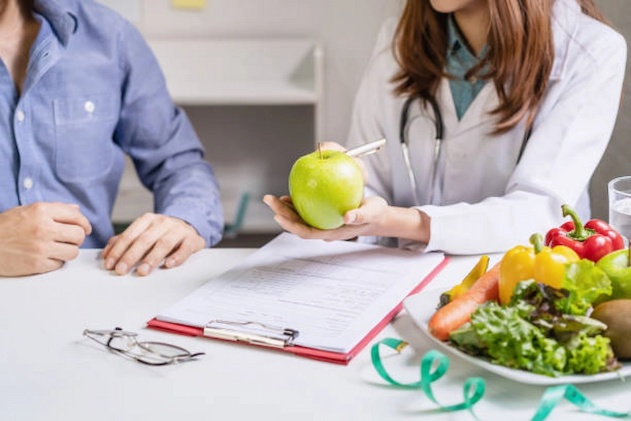 A nutrition consultation with fresh fruit on the desk
