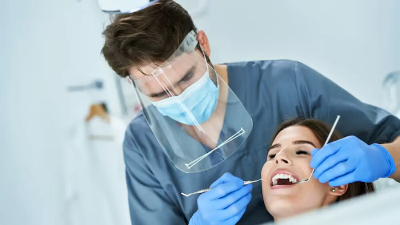 Patient receiving dental treatment at ATOS Clinic