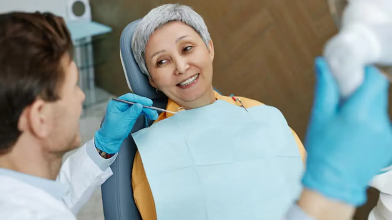 Patient receiving care for denture placement.